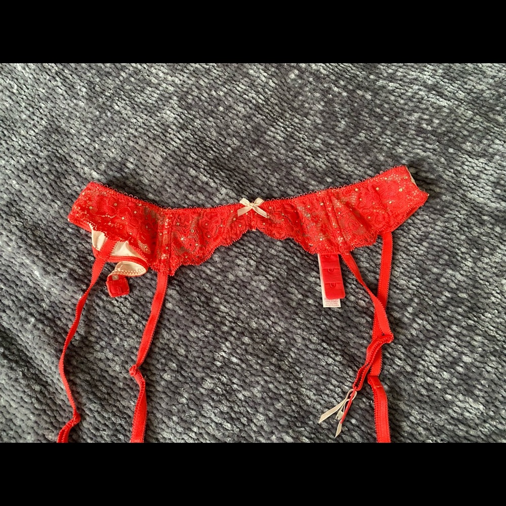 Victoria’s Secret red garter with gemstones